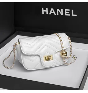 White quilted chain shoulder bag for women, elegant chevron crossbody bag with metal lock.