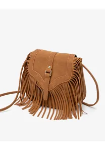 Brown suede fringe crossbody bag detail, vintage bohemian flap shoulder bag design.