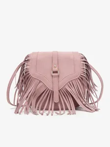 Boho fringe crossbody bag detail, vintage matte flap design, lightweight pink shoulder purse.