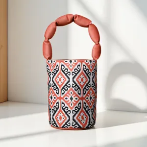 Ethnic style bucket handbag with unique segmented handle and traditional ikat pattern.