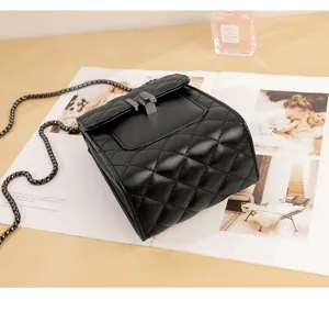 Black quilted mini shoulder bag with metal chain strap and lock for women stylish daily use