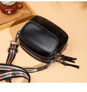 Black PU leather three-layer crossbody bag with retro design and stylish striped strap.