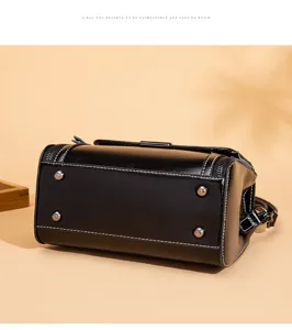 Black retro crossbody bag detail, high-quality leather, premium hardware accents and stitching.