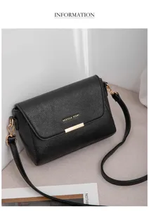 Vue détaillée du sac bandoulière en cuir noir texturé avec serrure en métal doré et élégant.