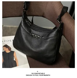 Black litchi leather shoulder bag detail, showing the premium texture and daily commute design.