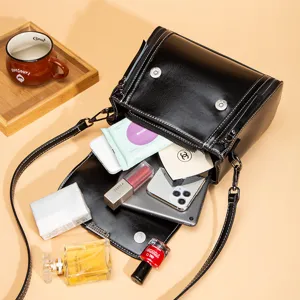 Vintage black leather women's crossbody bag with large capacity and stylish design.