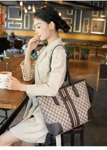 Detailed view of the vintage contrast color tote bag worn by a model in a cozy cafe.