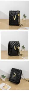Classic black quilted crossbody bag with gold chain strap and elegant metal lock closure.