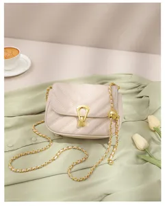Beige quilted crossbody bag with gold chain strap, chic single shoulder bag for women daily wear.