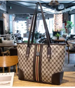 Detailed view of women's vintage print tote bag with color-blocked straps and large capacity.
