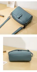 Detailed view of the stylish blue crossbody shoulder bag, showing premium texture and dual layers.