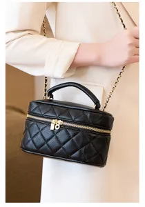 Elegant black quilted chain shoulder bag for women, stylish crossbody handbag with top handle.
