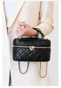 Detailed showcase of a stylish black quilted chain vanity bag featuring premium gold hardware.