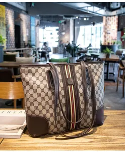 Detailed view of women retro contrast tote bag, stylish shoulder bag with classic stripe design.