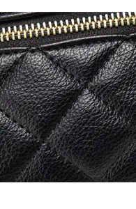 Black quilted leather bag detail showing luxury diamond stitching and gold zipper hardware.