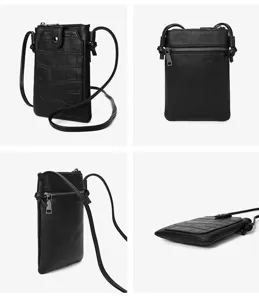 Black mini crossbody phone bag detail view showing crocodile pattern front pocket and zipper.