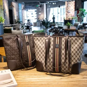 Stylish women's commuter tote bag with contrasting color stripes and large capacity vintage design.