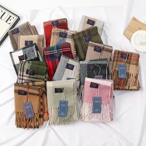 Cozy cashmere feel plaid winter scarf with classic fringe tassel design for warmth.