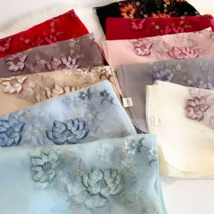 Detailed view of mulberry silk wool blend lotus embroidered scarf, elegant floral shawl.