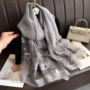 Exquisite lotus embroidered silk scarf for women, elegant mulberry silk blend shawl detail.