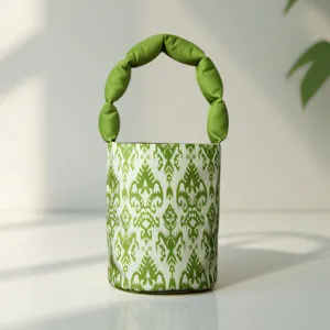 Ethnic style green Adles pattern bucket bag with unique puffed handle, detailed view.