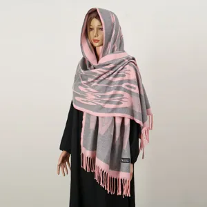 Xinjiang ethnic style knitted scarf and shawl with fringe, warm and stylish winter accessory.