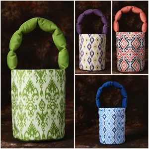 Ethnic style ikat print bucket bag with puffy handle, fashionable canvas casual handbag for women.