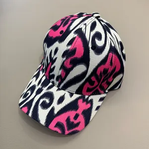 Xinjiang ethnic style baseball cap with vibrant Ikat print, unique curved brim hat for daily wear.