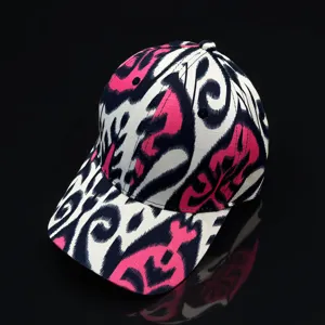 Ethnic Ikat pattern baseball cap detail shot, unique pink and black design for summer travel styling.