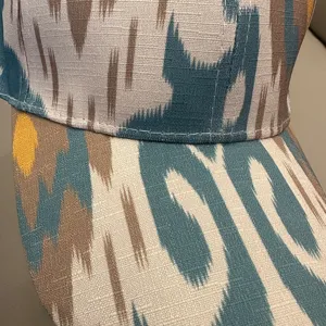 Detailed view of ethnic style printed baseball cap fabric texture and fine stitching