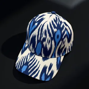 Detailed view of the blue and white ethnic style baseball cap featuring abstract fabric.