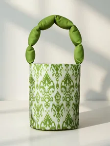 Xinjiang ethnic style bucket handbag with unique green bubble handle and traditional Atlas print.