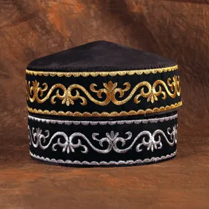 Detailed view of ethnic Kazakh style men embroidered hat with gold and silver thread motifs.