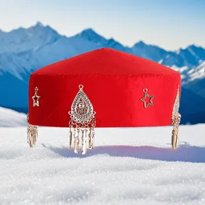 Traditional Kazakh ethnic red velvet hat featuring silver metal star and tassel pendants.