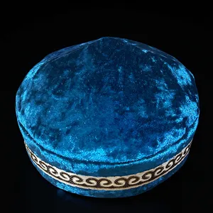 Kazakh ethnic velvet embroidered hat, traditional blue traditional cap with gold patterns detail.