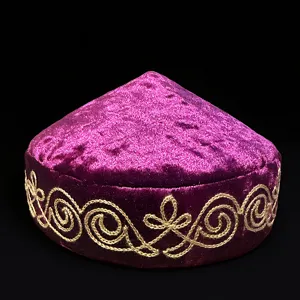 Kazakh style purple velvet embroidered hat detail, traditional ethnic gold thread embroidery.