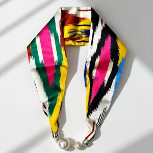 Detailed view of long ethnic silk scarf with magnetic pearl necklace buckle for women.