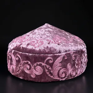 Kazakh ethnic embroidered velvet hat detail shot, traditional style pink floral cap.