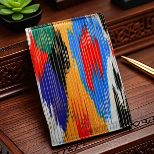 Xinjiang ethnic style fabric notebook detail view, colorful Ikat pattern passport cover design.