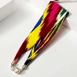 Colorful Atlas silk scarf with magnetic pearl necklace pendant, elegant long strip design for women.