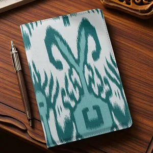 Xinjiang ethnic style fabric notebook with traditional ikat printed pattern and neat stitching.