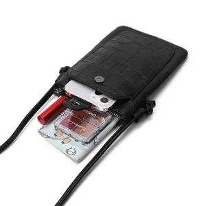 Stylish black crocodile pattern mini crossbody phone bag with compact capacity for use.