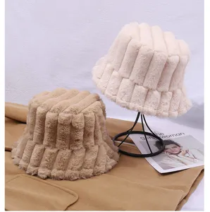 Detailed view of winter plush bucket hat, cozy vertical striped fleece material, warm design.