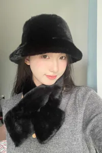 Stylish black plush bucket hat and fuzzy scarf set for women, warm winter fashion accessory.