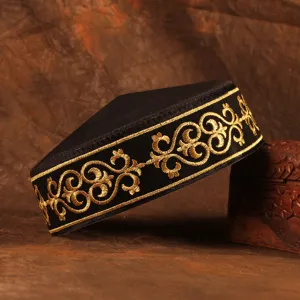 Detailed view of a traditional Kazakh style black and gold embroidered ethnic cap for men.
