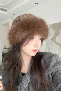 Cozy brown faux fur bucket hat for women, stylish winter warm furry plush cap detail.