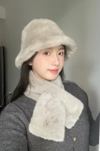 Plush bucket hat and warm winter scarf set, soft faux fur material for cold weather daily wear.