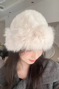 Detail shot of fluffy plush bucket hat in off-white, soft winter warm furry hat for women.
