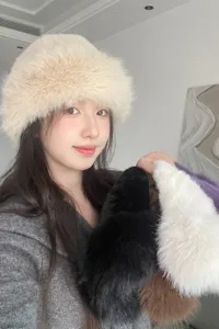 Detail shot of trendy autumn winter plush bucket hat, soft furry warm cap for women style.