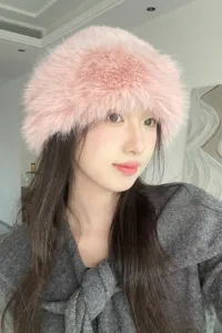 Stylish pink fluffy plush bucket hat for women, cozy winter warm faux fur fashion cap.